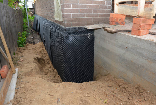Happy homeowners after waterproofing job in Maplewood